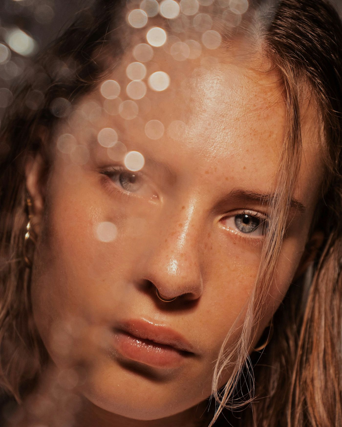 A close portrait of a woman's face in soft light